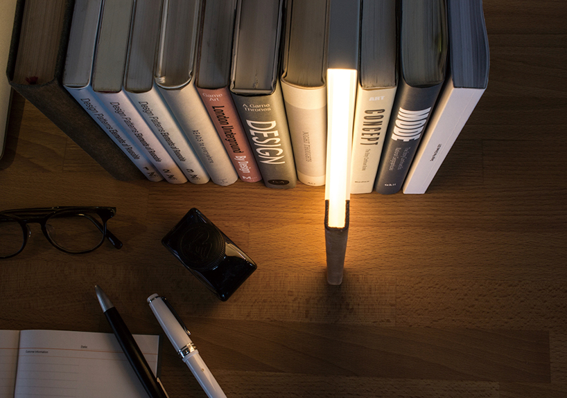 Stack of books and writing tools on a desk